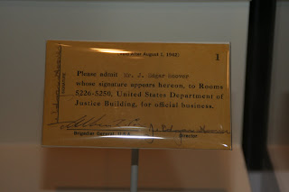 Pass signed by J. Edgar Hoover approving his attendance at 1942 trial of Nazi saboteurs on display at Newseum. Trial pass for J. Edgar Hoover, 1942. 2010.11. Collection of the National Law Enforcement Museum, Washington, D.C.