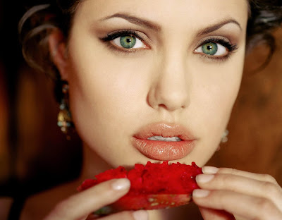 Angelina Jolie eating a strawberry and other photos