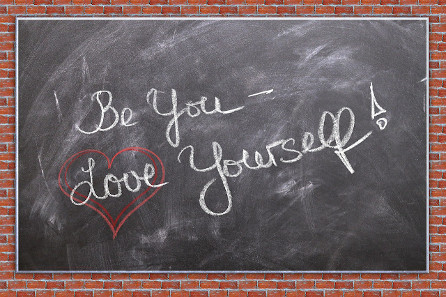 A black board. WOrds written with chalk. Thy say: "Be you - love yourself"