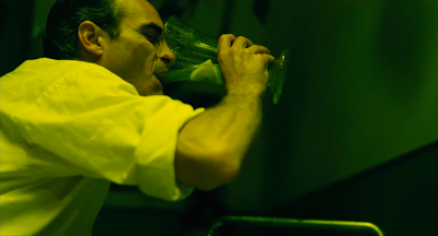 Joaquin Phoenix as Freddie Quell in The Master, drinks the coctailed booze, directed by Paul Thomas Anderson