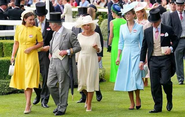 Queen Camilla wore a silk dress by Anna Valentine, Lady Gabriella a Claire Mischevani dress, and Lady Sophie a yellow dress by Beulah
