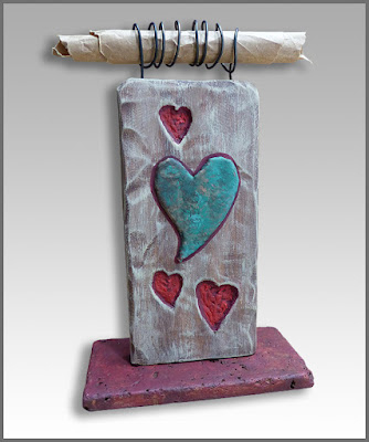 Heart side of small desktop wood sculpture