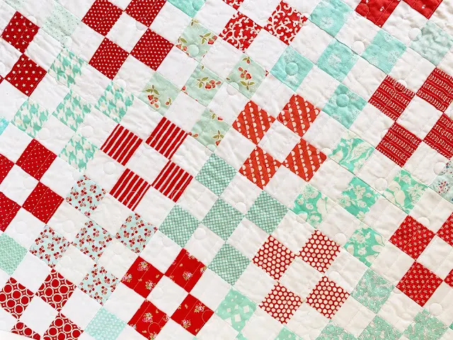red and aqua nine patch quilt