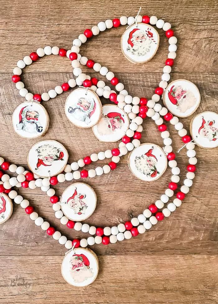 red and white beaded garland with Santa wood slices