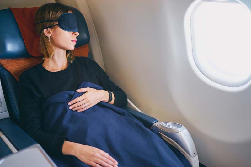The Best Way to Fall Asleep on a Flight, Says Expert