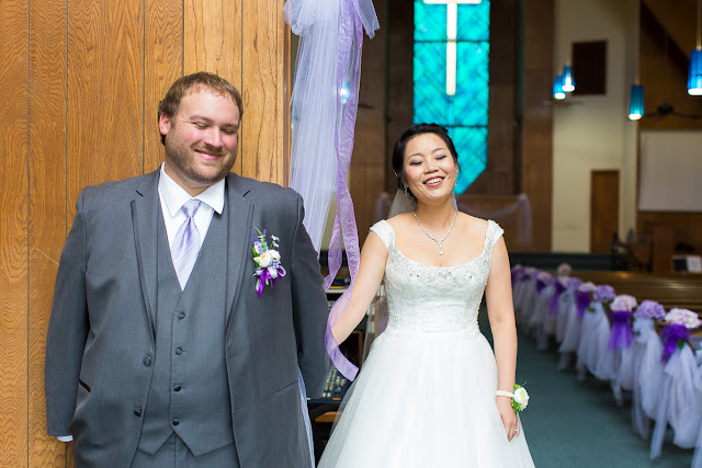 He can't see her, and all she sees is his outstretched hand  reaching to hold hers.  It is their First Look without looking, and they are sharing a private moment with high anticipation.  The next time they will be together, it will be at the altar getting married.  They smile at the delight this brings to them.  Set at the Oklahoma Southern Baptist Church in Norman, OK.