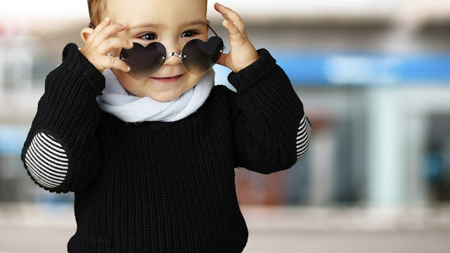 stylish baby with heart glasses