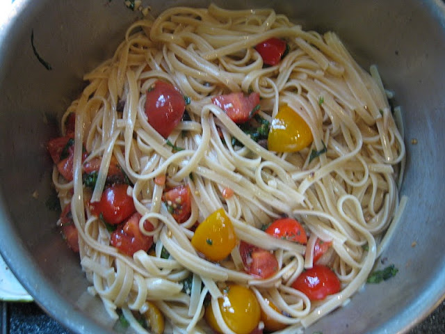 Food Lust People Love: Funky spaghetti is a cross between warm salad and tasty linguine, with tomatoes, olives and basil! Serve it as a main course or side dish.