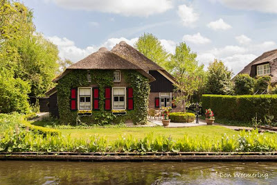 Can you imagine a village with no roads? There is such a place in the Netherlands called Giethoorn (pronounced 'geethorn'). There are no roads and cars have to remain outside the village. The only access to the stunningly lovely houses in Giethoorn is by water, or on foot over tiny individual wooden bridges.