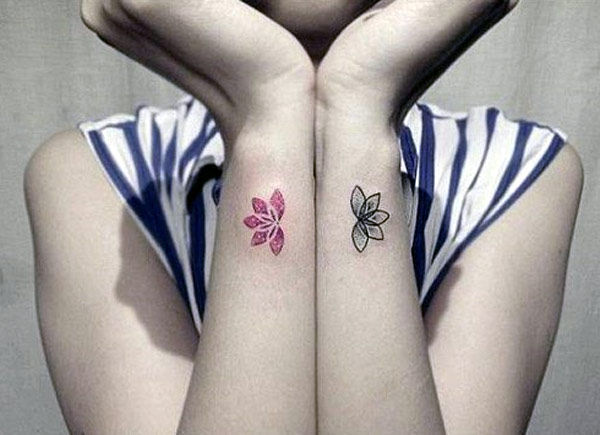 The small tattoos lotus designs really nicely for girl wrists.