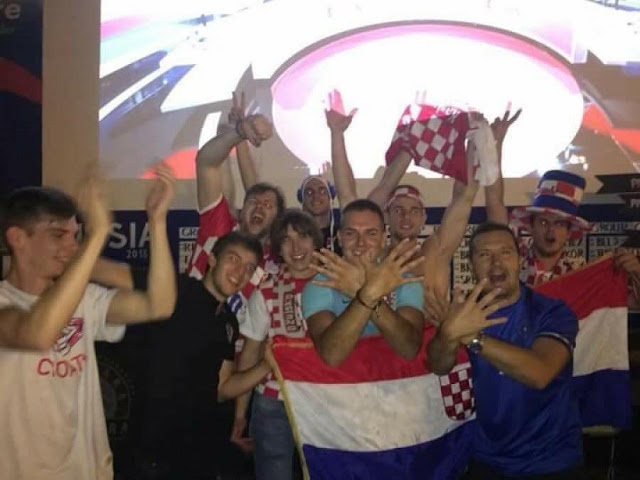 Croatian fans celebrate the victory with the Albanian symbol of double headed eagle