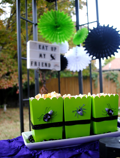 Halloween candy corn popcorn in popcorn boxes creeped up with spider stickers 