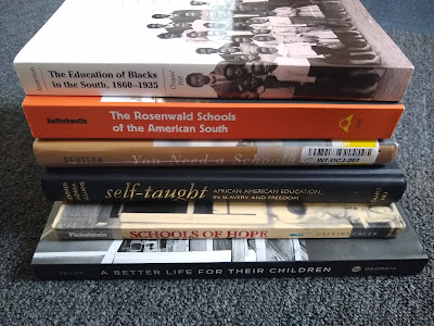 Stack of Books on a blue-gray carpet