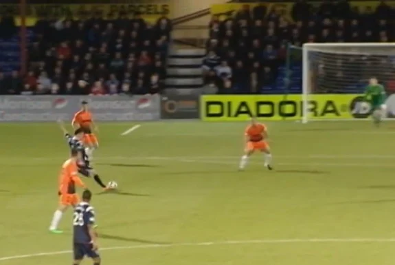 Ross County player Filip Kiss shoots to score his side's third goal against Dundee United