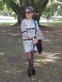 Black&white-shift-dress-animal-print-coat-turquoise-handbag
