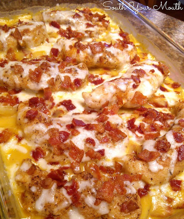 Smothered Chicken Casserole! A simple casserole recipe with layers of creamy potatoes - think Potatoes Au Gratin or Scalloped Potatoes - topped with chicken, smothered with cheese and bacon!