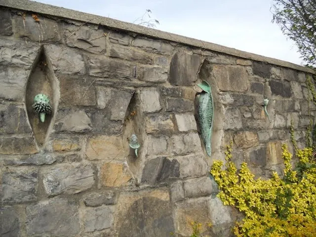 Carvings in a stone wall at Blessington Street Basin in Dublin in June