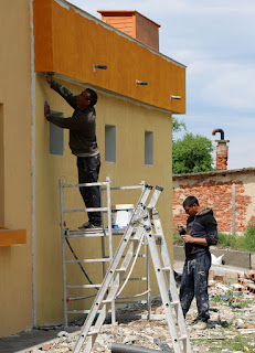 Plastering underneath the balcony overhang