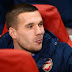 Podolski happy to stay at Arsenal