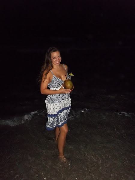 On the beach with a coconut full of rum!