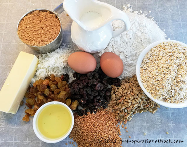 Ingredients for South African buttermilk muesli rusk batter, karringmelk beskuit, beskuit, with nuts, raisins, self-rising flour, butter, oil, flax, sunflower seeds, eggs