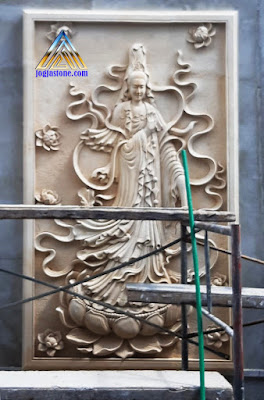 Ukiran relief tempel dinding dewi kwan im