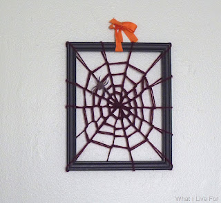 Framed yarn spider web