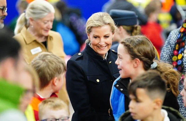 Sophie, Duchess of Edinburg wore a logo buckle belted wool jacket by Bally for visit to Yeo Valley Farm and Organic Garden