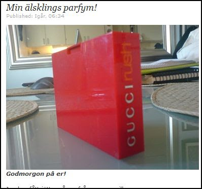 Linda Rosing har en bild på parfym i sin blogg. En röd låda.