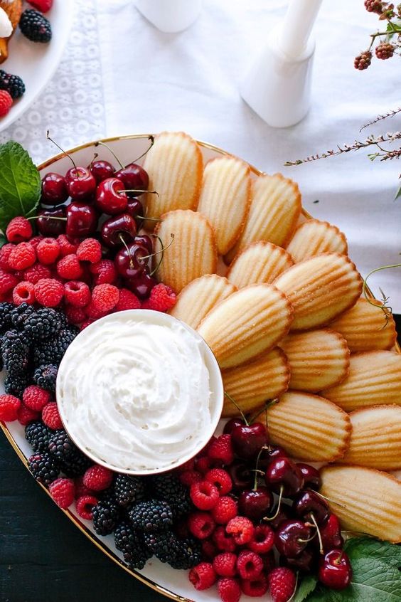 Fresh berries, whip cream and Madelines make a beautiful dessert tray. Not to mention it is super easy to put together. Great idea for a glamorous Oscars party!