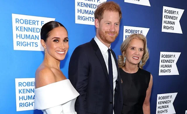 The Duchess wore a custom white gown by Nicolas Ghesquiere for Louis Vuitton. Meghan Markle is wearing Diana’s aquamarine ring