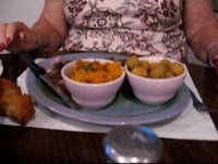 Click to enlarge - Grilled boneless pork chops (hiding behind the bowls) with two sides, one of fried okra and some garlic bread