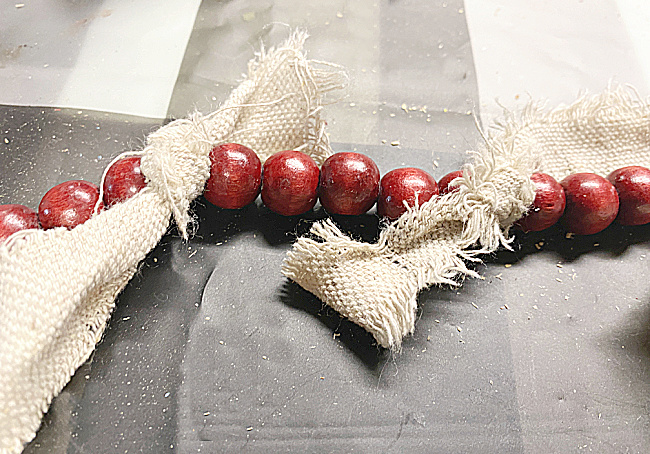red beads and rag bows