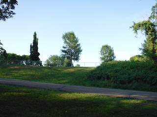 the dog park at Bacon Creek Park is visible from the main parking area