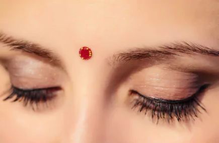 bindi significance, why do women wear bindis, bindicultural appropriation, how to put bindi on forehead, importance of bindi, science behind bindi