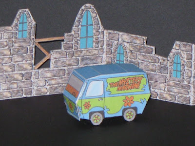 This 2 5 cm long Scooby Doo Mystery Machine van and ruined castle wall