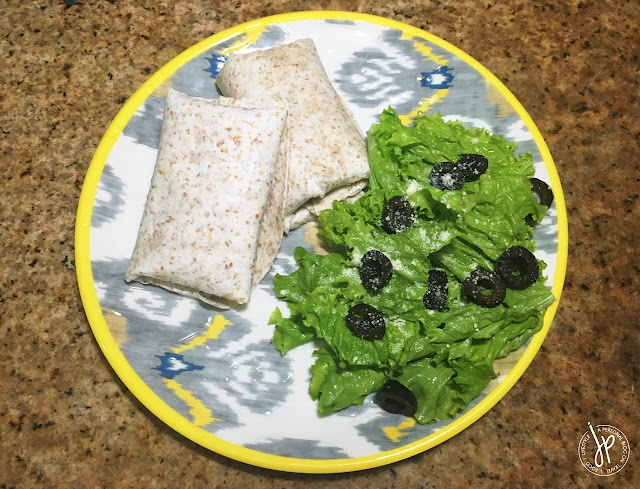 Tuna Pocket Wraps with lettuce and olives on the side