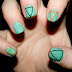 COLOURFUL TRIANGLE OUTLINES ON GREEN NAILS