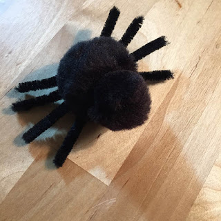 cute black pom pom spider