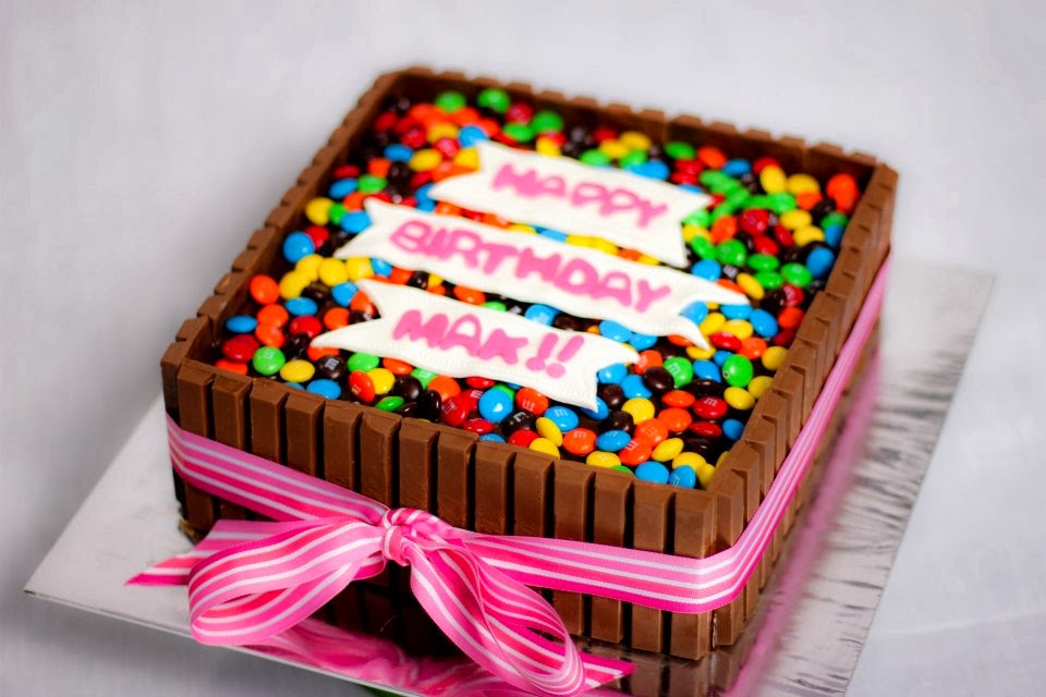 This is a square shaped cake using kitkats, I love the pink ribbon ...