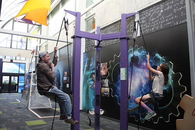 Fun using pulley systems at Putnam Museum