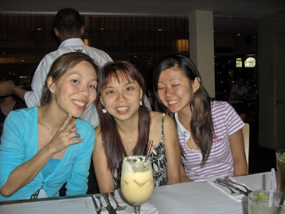 Girls posing while waiting for food