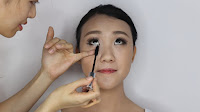Modern Oriental Bridal Makeup - Coat on some mascara on the lower lashes
