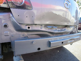 Collision damaged Mazda 3 before auto body repairs & paint at Almost Everything Auto Body