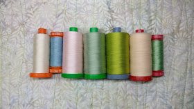 Aurifil thread in many weights used for machine quilting