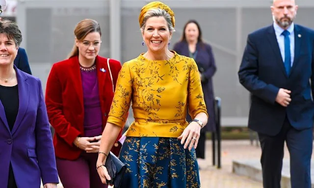 Queen Maxima wore an embroidered silk satin yellow top and an embroidered silk satin royal blue skirt by Natan