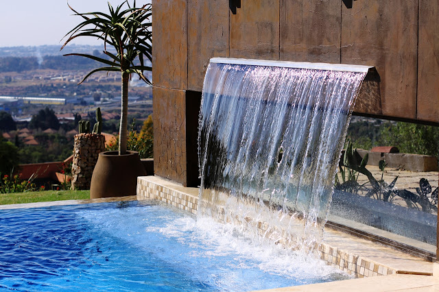 Waterfall into the swimming pool