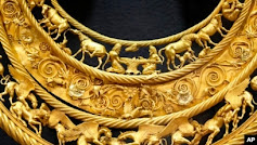 Gold necklace with animal figurines.