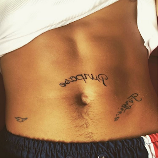 Justin Bieber tattooed new album name on his stomach.