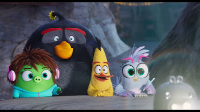 The Angry Birds Movie 2 film still featuring Courtney (Awkwafina), Bomb (Danny McBride), Chuck (Josh Gad), and Silver (Rachel Bloom) preparing to take on Eagle Island